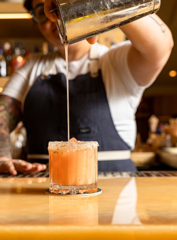 Bartender pouring a cocktail in Lake Worth Beach